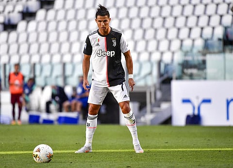 Juventus' Cristiano Ronaldo concentrates moments before scoring his side's thrid goal on a free-kick, during the Serie A soccer match between Juventus and Torino. (Photo | AP)