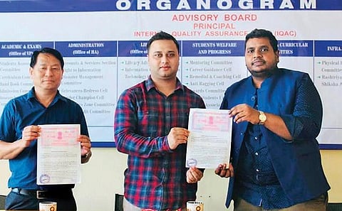 An MoU being signed between DM Thavaseelan K (R) and a college for a training centre (Photo | EPS)