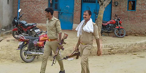 Police personnel during a search operation near the residence of main accused in the Kanpur encounter case Vikas Dubey. (Photo| PTI)