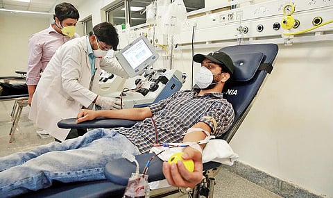A youth donates plasma for Covid treatment at the plasma bank established at the Institute of Liver and Biliary Sciences. (Photo| Shekhar Yadav, EPS)