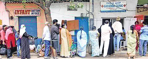 With cases on the rise, residents queue up in large numbers outside a clinic in Bengaluru, on Monday | Nagaraja Gadekal