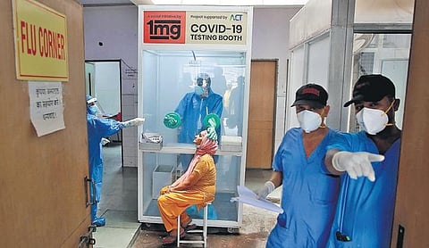 A woman giving sample for Covid-19 test in New Delhi on Monday (Photo | Shekhar Yadav, EPS)