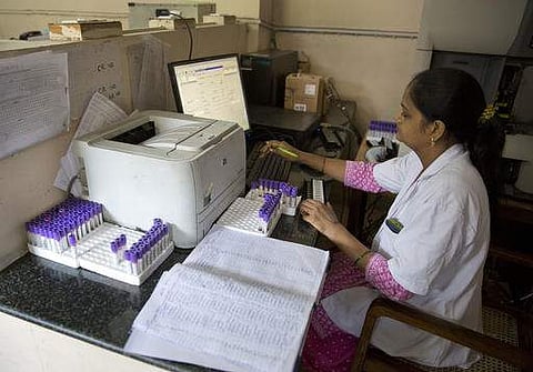 A laboratory worker arranges blood samples. (File Photo | AP)