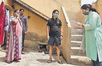 A school teacher conducts door-to-door survey to detect Covid-19 symptomatic cases at Mahipalpur in New Delhi | FILE