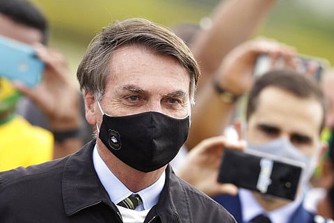 Brazil's Bolsonaro becomes 'poster boy' for 'dubious' COVID-19 cure as he promotes HCQ