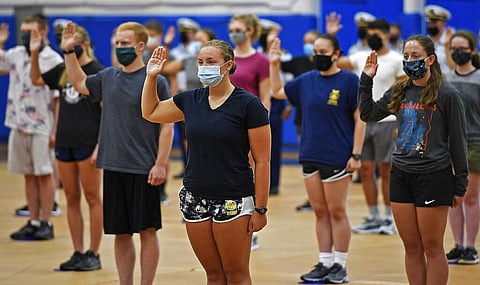 Members of the U.S. Coast Guard Academy Class of 2024 take the oath of office as they report in for the start of Swab Summer, Wednesday, July 8, 2020, in New London, Conn. (Photo | AP)