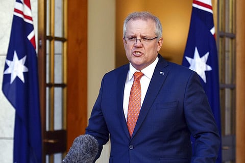 Australian Prime Minister Scott Morrison speaks at a press conference at Parliament House in Canberra, Thursday, July 9, 2020. Australia suspended its extradition treaty with Hong Kong and extended visas for Hong Kong residents in response to China's impo