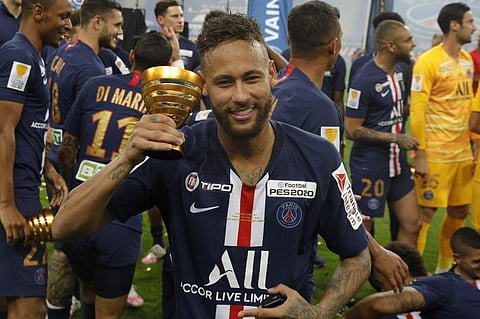 Paris Saint-Germain's Brazilian forward Neymar celebrates their victory at the end of the French League Cup final football match. (Photo | AFP)