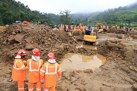 Fire fighters and NDRF teams are conducting a search operation at Pettimudi near Rajamala in Munnar. (Photo | EPS)