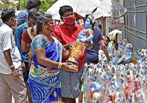 Residents shop for Lord Krishna idols at Thiru Vi Ka Nagar on Monday  | P Jawahar