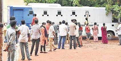 People queue up at an iMASQ bus to give their samples for Covid-19 testing, in Vijayawada on Moday (Photo | P Ravindra Babu, EPS)