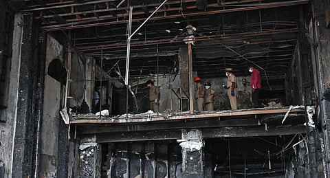 Andhra Pradesh Officials of Fire and Police departments visit Swarna Palace for inspection where 10 covid-19 patients died in a fire accident in Vijayawada (Photo | Prasant Madugula, EPS)