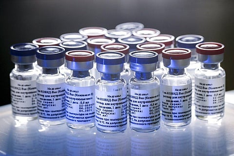 In this photo provided by Russian Direct Investment Fund, a new vaccine is on display at the Nikolai Gamaleya National Center of Epidemiology and Microbiology in Russia on Aug. 6, 2020.(Photo | AP)