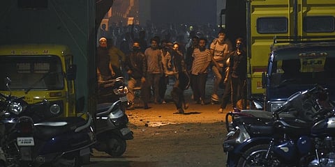 Thousands gathered in front of a Karnataka MLA's house and set fire to vehicles parked in front of it. (Photo | EPS)