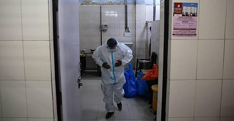 A health worker suits up to collect samples for rapid antigen based Covid-19 testing in New Delhi. (Photo | Shekhar Yadav, EPS)