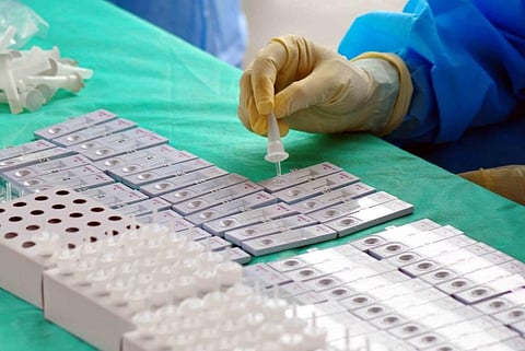 A health worker sorting the samples collected at the Rapid Test Camp in Visakhapatnam on Thursday. (Photo | G Satyanarayana/EPS)