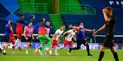 RB Leipzig players celebrate after winning their Champions League quarterfinal match against Atletico Madrid at the Jose Alvalade stadium in Lisbon. (Photo | AP)