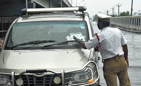 Traffic police checking the e-pass in Chennai. (Photo | Ashwin Prasath, EPS)