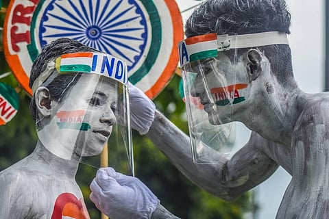 Members of Vandemataram group performing a patriotic street play on the eve of Independence Day at Mahatma Gandhi marg in Bhubaneswar on Friday. (Photo | Biswanath Swain/EPS)