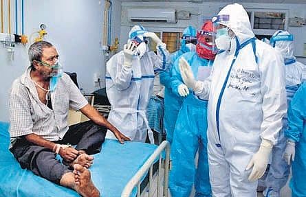 Chevireddy Bhaskar Reddy interacts with patients at Padmavathi State COVID-19 Hospital in Tirupati on Friday | MADHAV K