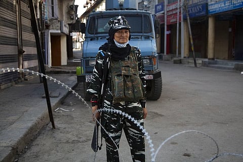 A paramilitary soldier stands guard by a road near the venue for India's Independence Day ceremony in Srinagar, Saturday, Aug. 15, 2020. (Photo | AP)