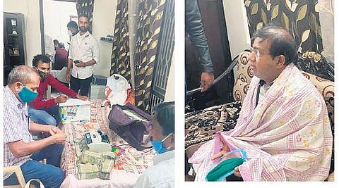 ACB officials count the cash received by Keesara tahsildar E Nagaraju as bribe.  (Right) Nagaraju looks on