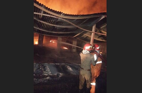 Fire service staff trying to douse the blaze that broke out at KINFRA industrial park. (Photo | Express)