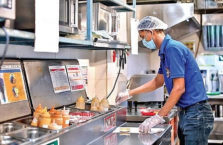In fast food restaurant in Delhi, you can now see your burgers being made