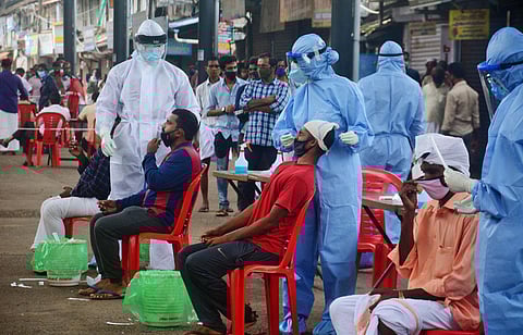 Covid 19 test conducted at Valiyangadi market in Kozhikode. (Photo | Manu R Mavelil, EPS)