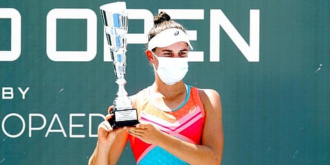 Jennifer Brady holds the championship trophy after defeating Jil Belen Teichmann in the WTA tennis tournament championship match in Nicholasville. (Photo | AP)