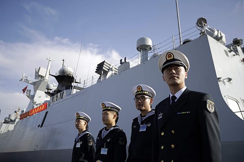 Chinese Navy officials stand in front of the ship Daqing during a visit in San Diego. (Photo| AP)
