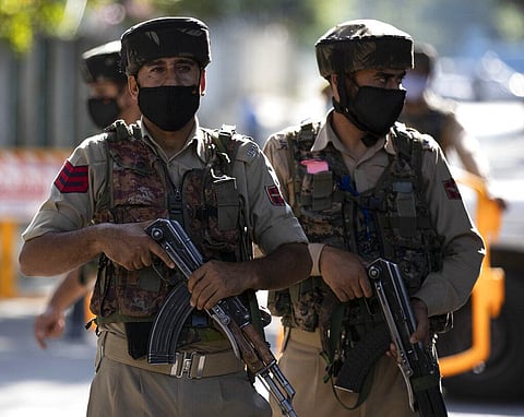 Jammu Kashmir policemen stand guard near the venue for India's Independence Day ceremony in Srinagar, Saturday, Aug. 15, 2020. (Photo | AP)