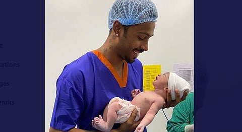 Pandya is seen holding the baby boy in his arms. (Photo | Hardik Pandya, Twitter)