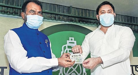 RJD leader Tejashwi Yadav (R) welcomes Shyam Rajak into the party | PTI