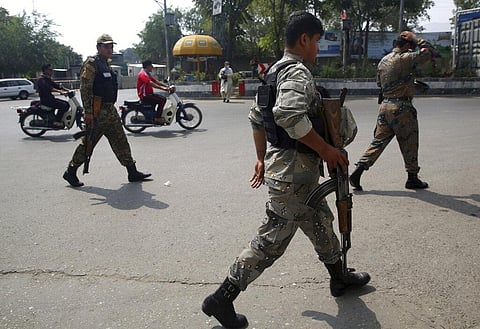 Police inspect the site of a rocket attack in the city of Kabul during Independence Day celebrations at the Defense Ministry in Kabul, Afghanistan, Tuesday. (Photo | AP)
