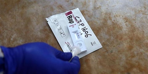A medical lab technician collects swab sample. (Photo | Shekhar Yadav, EPS)
