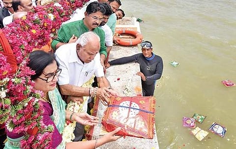 Chief Minister BS Yediyurappa and Mandya MP Sumalatha Ambareesh offer bagina at KRS dam in Mandya district in August last year | Udayshankar S
