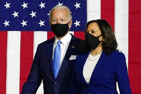 Democratic presidential candidate former Vice President Joe Biden and his running mate Sen. Kamala Harris, D-Calif., arrive to speak at a news conference in Wilmington (Photo | AP)