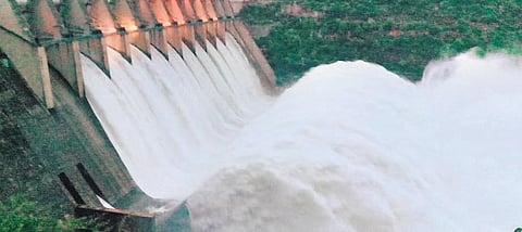 Due to heavy inflows into Srisailam reservoir, irrigation officials lift 10 crest gates of the dam. (Photo | EPS)