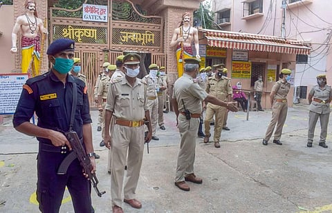 Security personnel stand guard at Sri Krishna Janmasthan temple after a suspected ISIS operative who had planned terror strikes was arrested in the national capital in Mathura Saturday. (Photo | PTI)