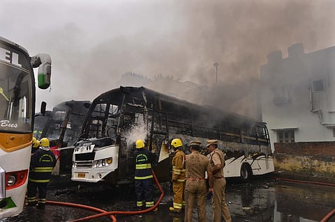 Fire brigades busy dousing fire caught in three buses parked at Koyembedu Omni Bus Stand in Chennai on Sunday.  (Photo | EPS/Debadutta Malick)