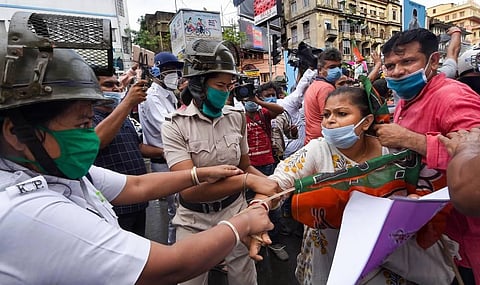 Police detain BJP activists during a protest demonstration over alleged vandalism at Visva-Bharati campus in Kolkata Wednesday Aug. 19 2020. (Photo | PTI)