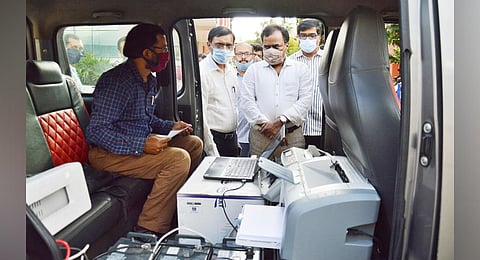 Water board MD M Dana Kishore inaugurates a mobile collection van at the board’s head office on Monday