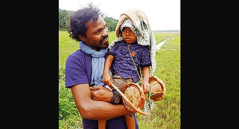 Vinu with ‘Thudi’, a native musical instrument of Paniyar community