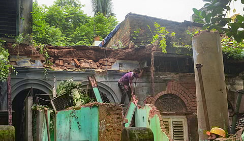 KMC workers prepare to demolish a century-old building after it collapsed, at Beliaghata in Kolkata. (Photo | PTI)