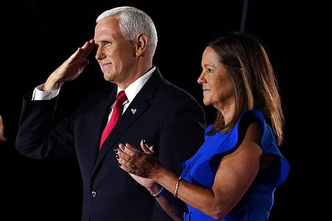 Vice President Mike Pence salutes on stage with his wife Karen after speaking on the third day of the Republican National Convention.(Photo | AP)