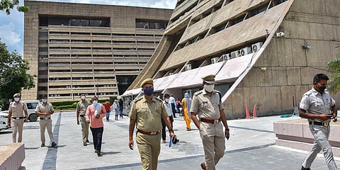 Police investigate in the premises of the NDMC building after a woman helper allegedly jumped off its 11th floor to commit suicide. (Photo| PTI)