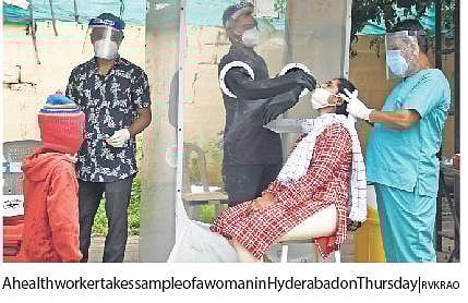 A health worker takes sample of a woman in Hyderabad on Thursday | RVK Rao
