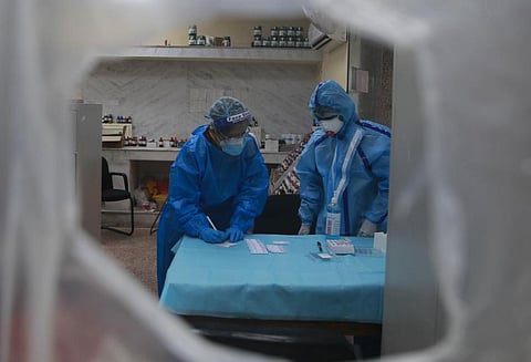 Health workers collect swab samples for coronavirus through rapid antigen tests. (Photo | Shekhar Yadav, EPS)