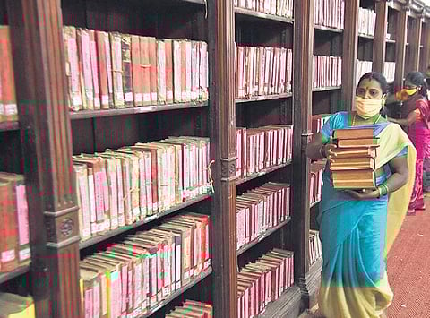 The staff at Connemara Public Library gearing up for the reopening on  September 1, at Egmore in Chennai on Friday | r satish babu